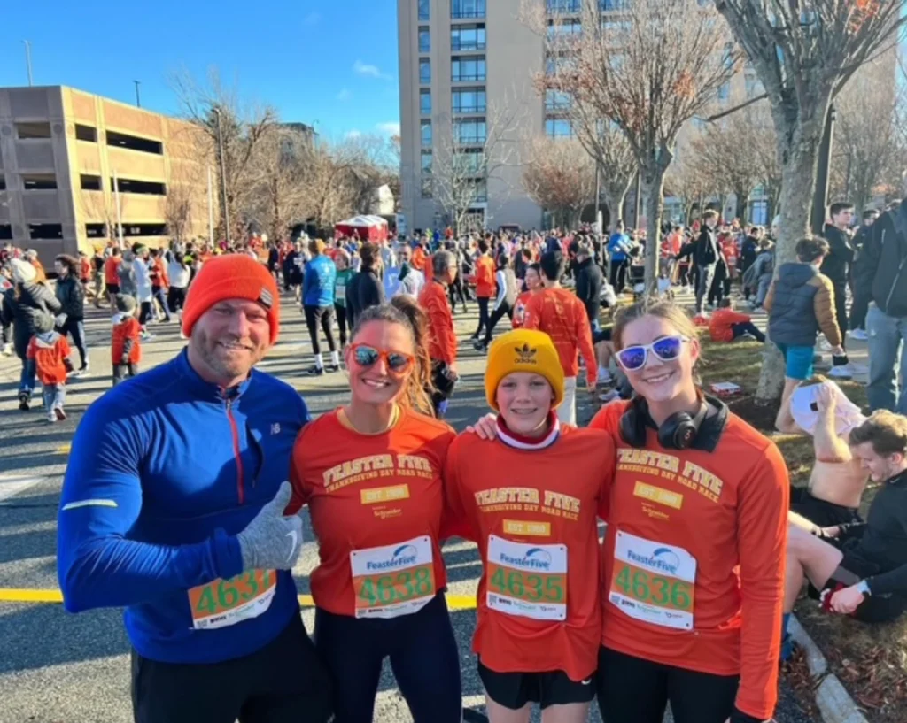 April Liles with family after participating in a road race