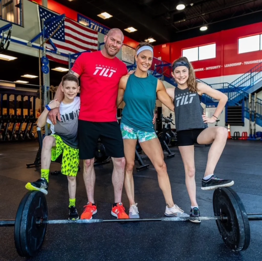 April Liles with family at a CrossFit gym