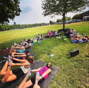 Group participating in an outdoor fitness and wellness activity