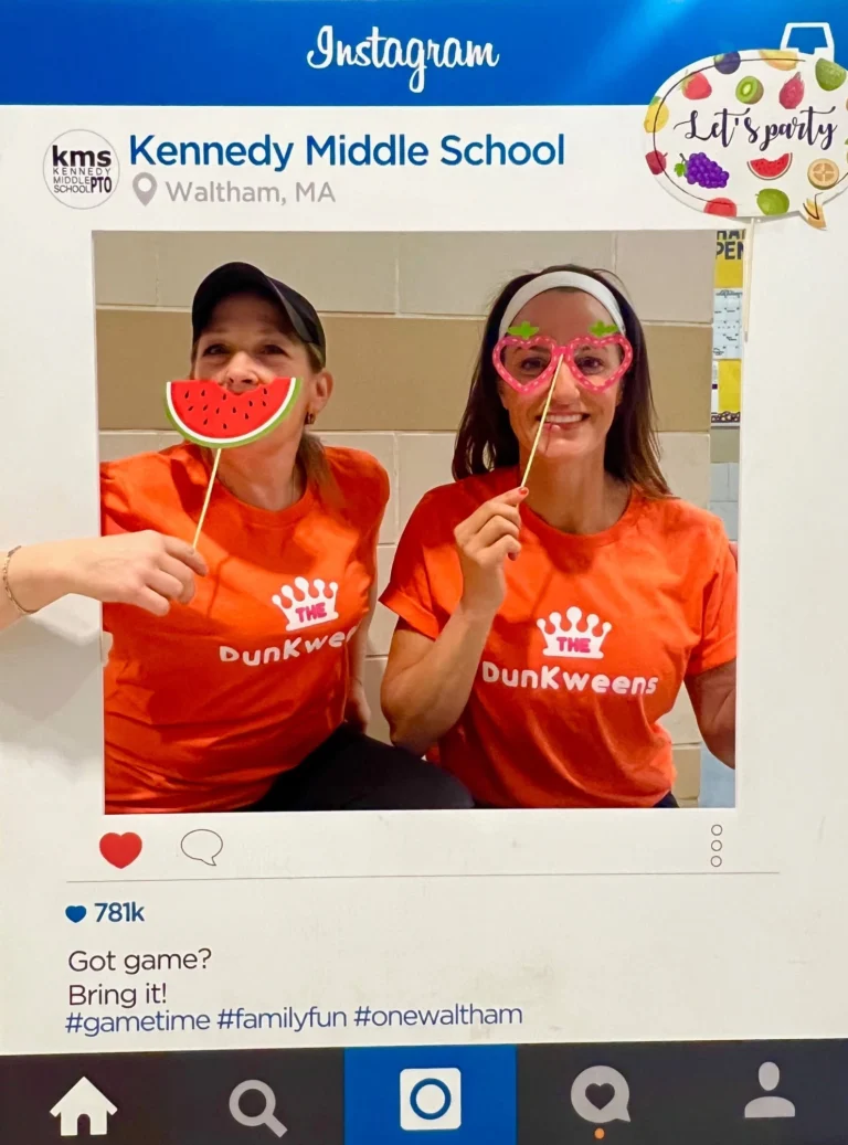 April Liles and colleague posing at a Kennedy Middle School nutrition event in Waltham, Massachusetts